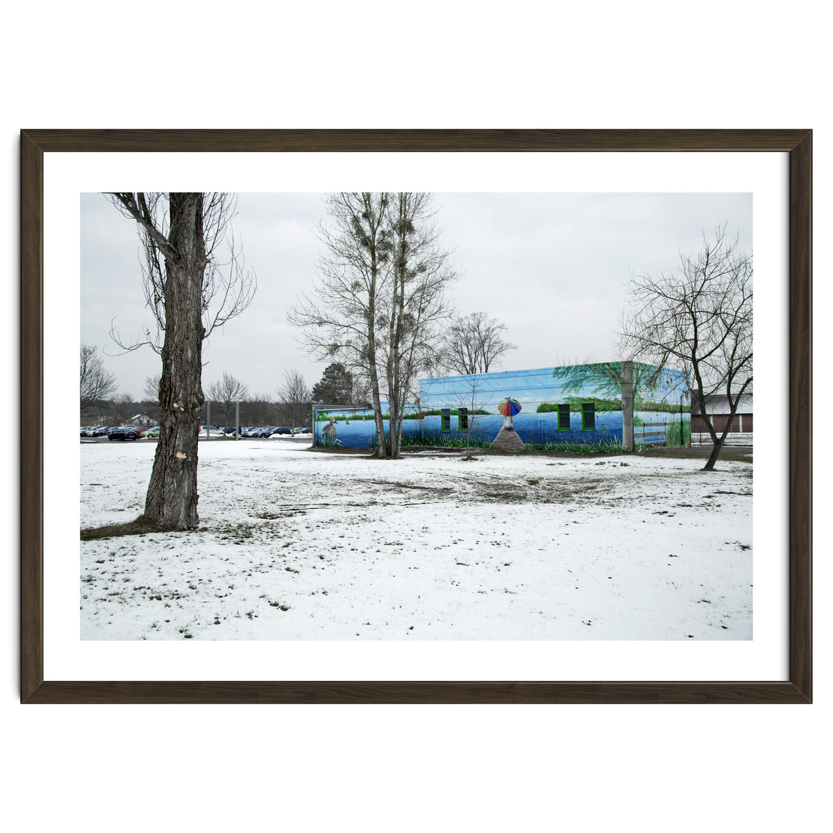 Colorful barn in the snowy ground landscape