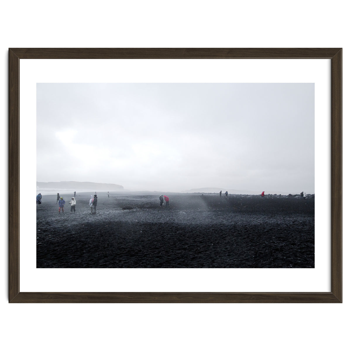 Tourists on the black sand beach - Iceland