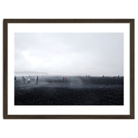 Tourists on the black sand beach - Iceland