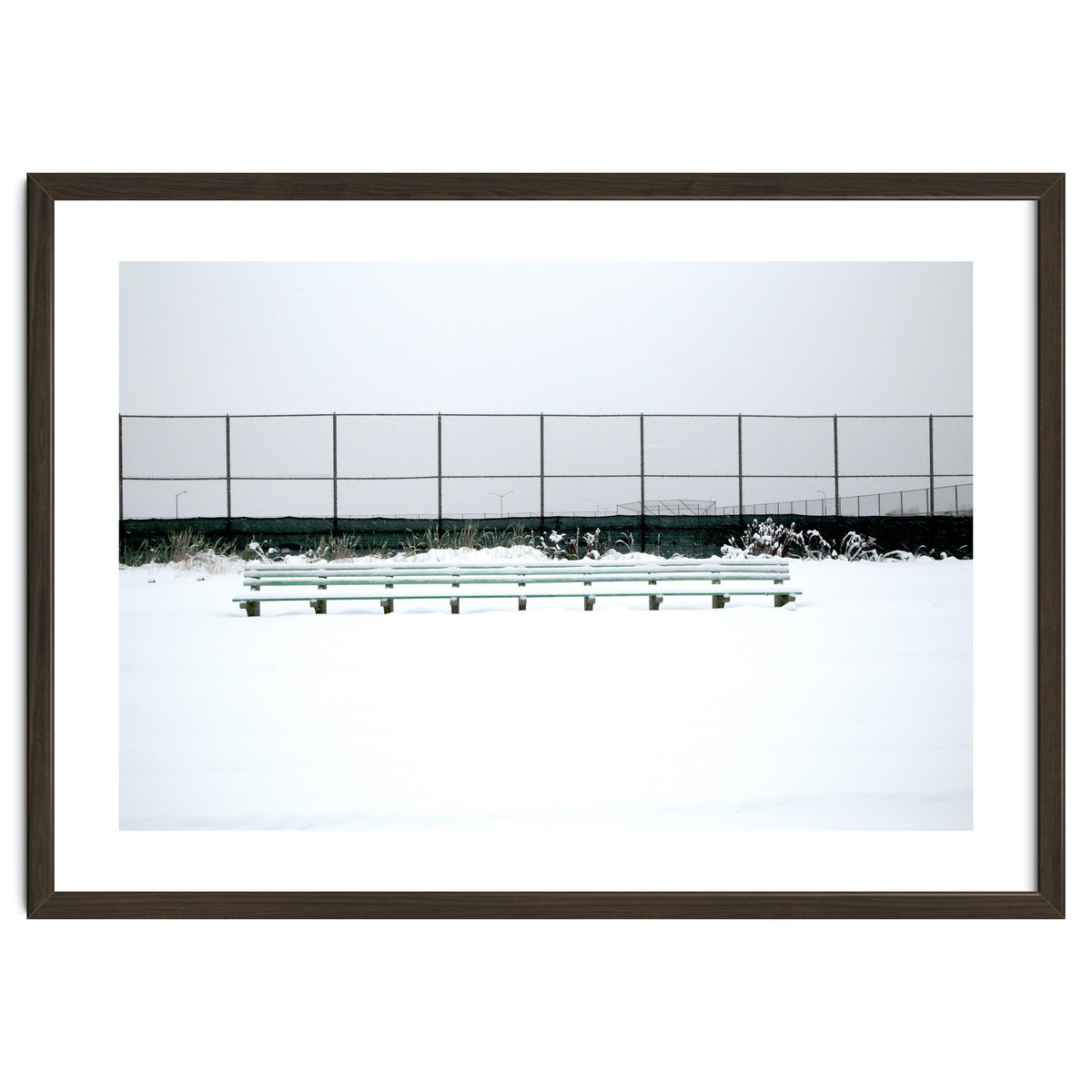 Bench with no people in snowy winter