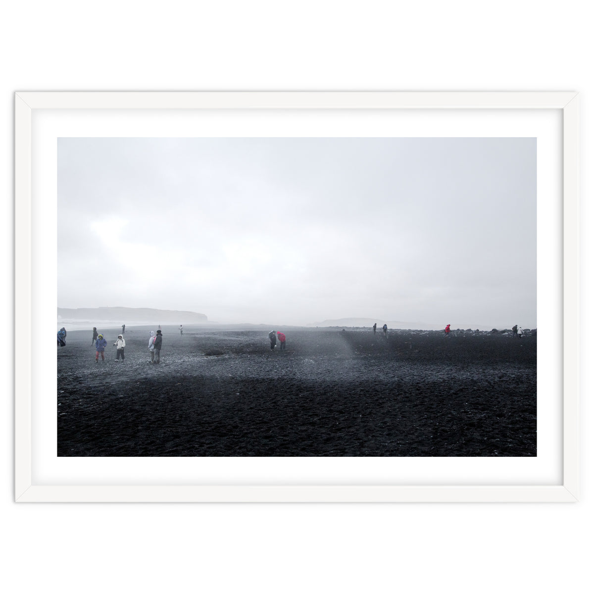 Tourists on the black sand beach - Iceland