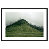 Green mountain covered in clouds - Iceland thumbnail