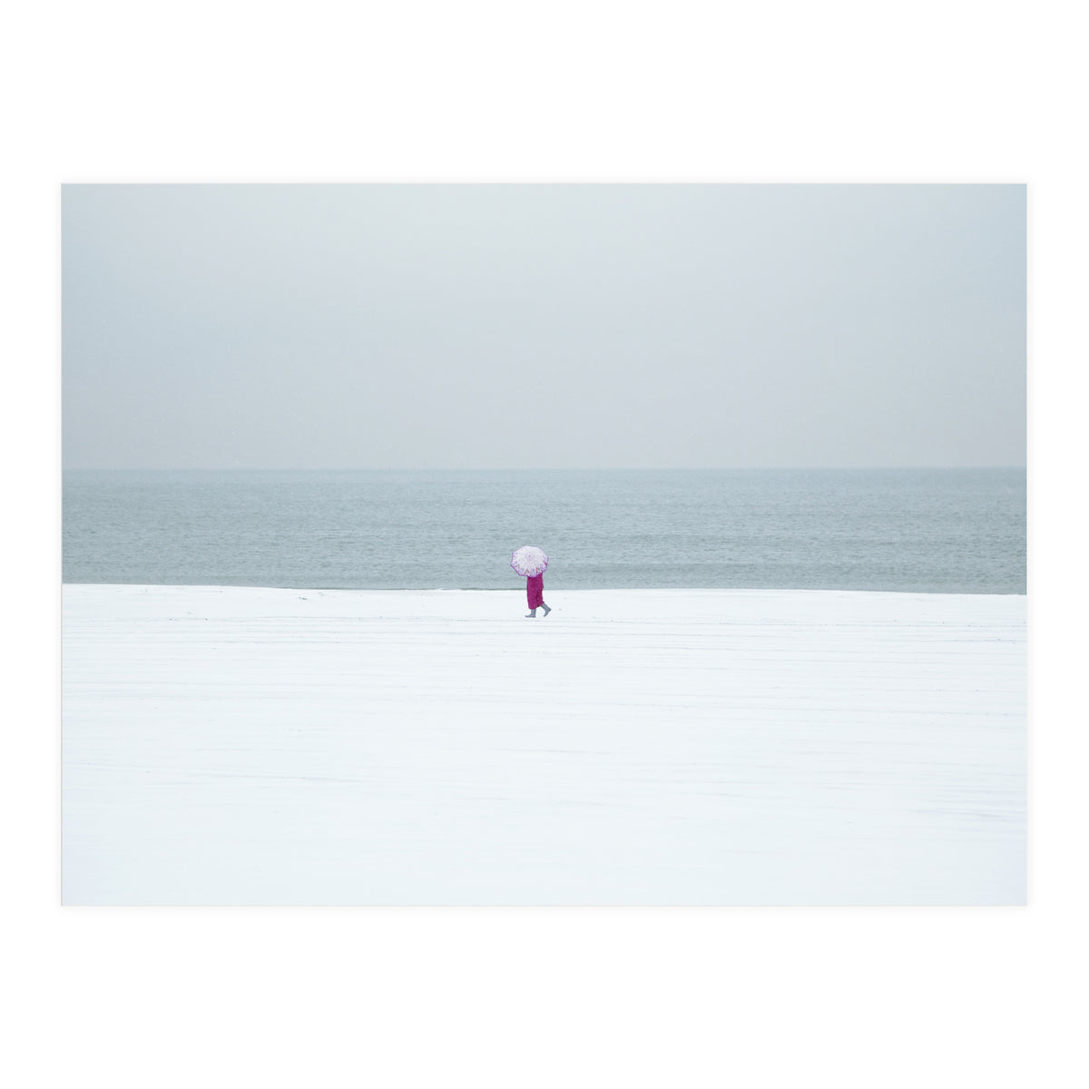 A walking woman in the winter snow beach (Print Only)