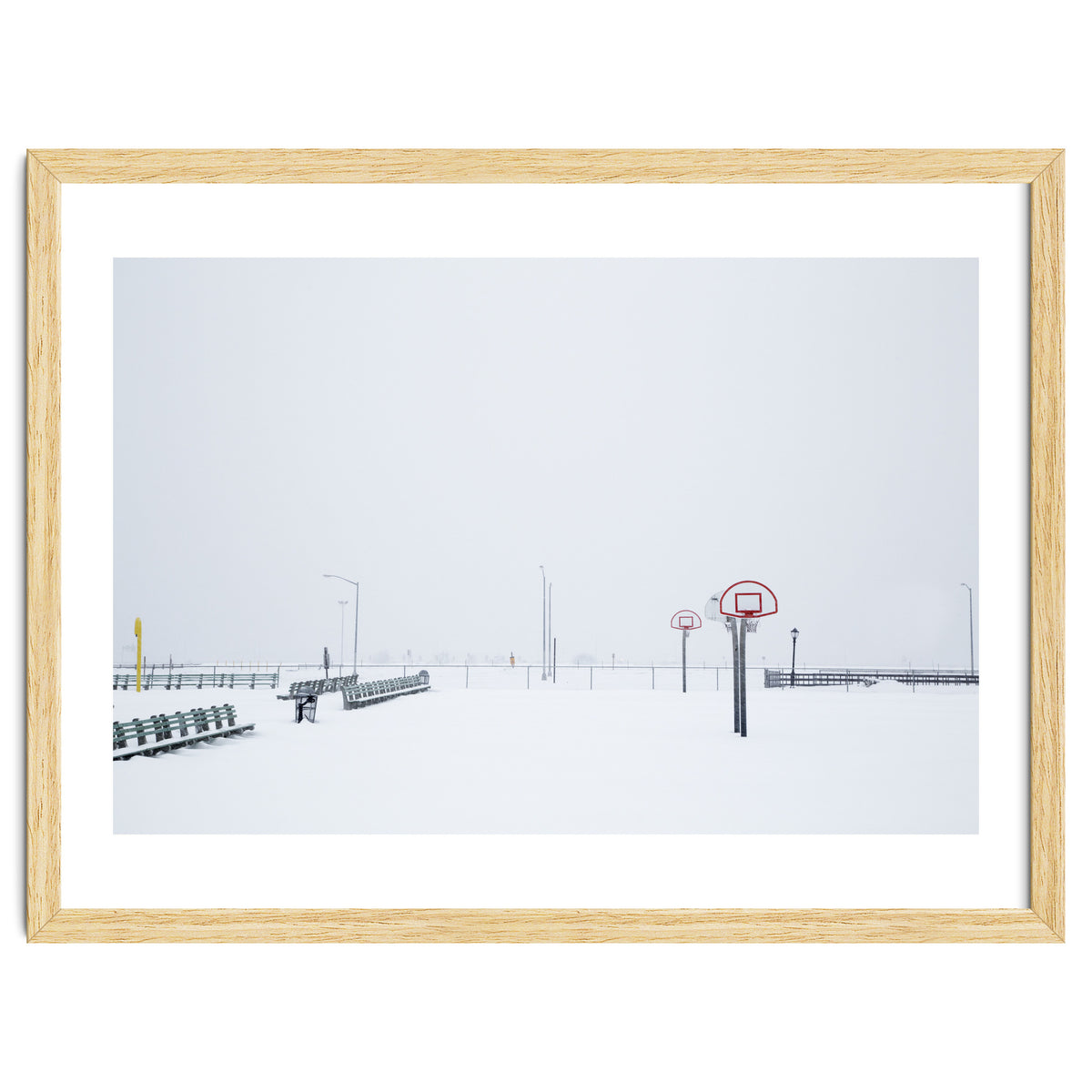 Snow-covered Basketball court and side bench