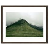 Green mountain covered in clouds - Iceland thumbnail