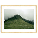 Green mountain covered in clouds - Iceland thumbnail