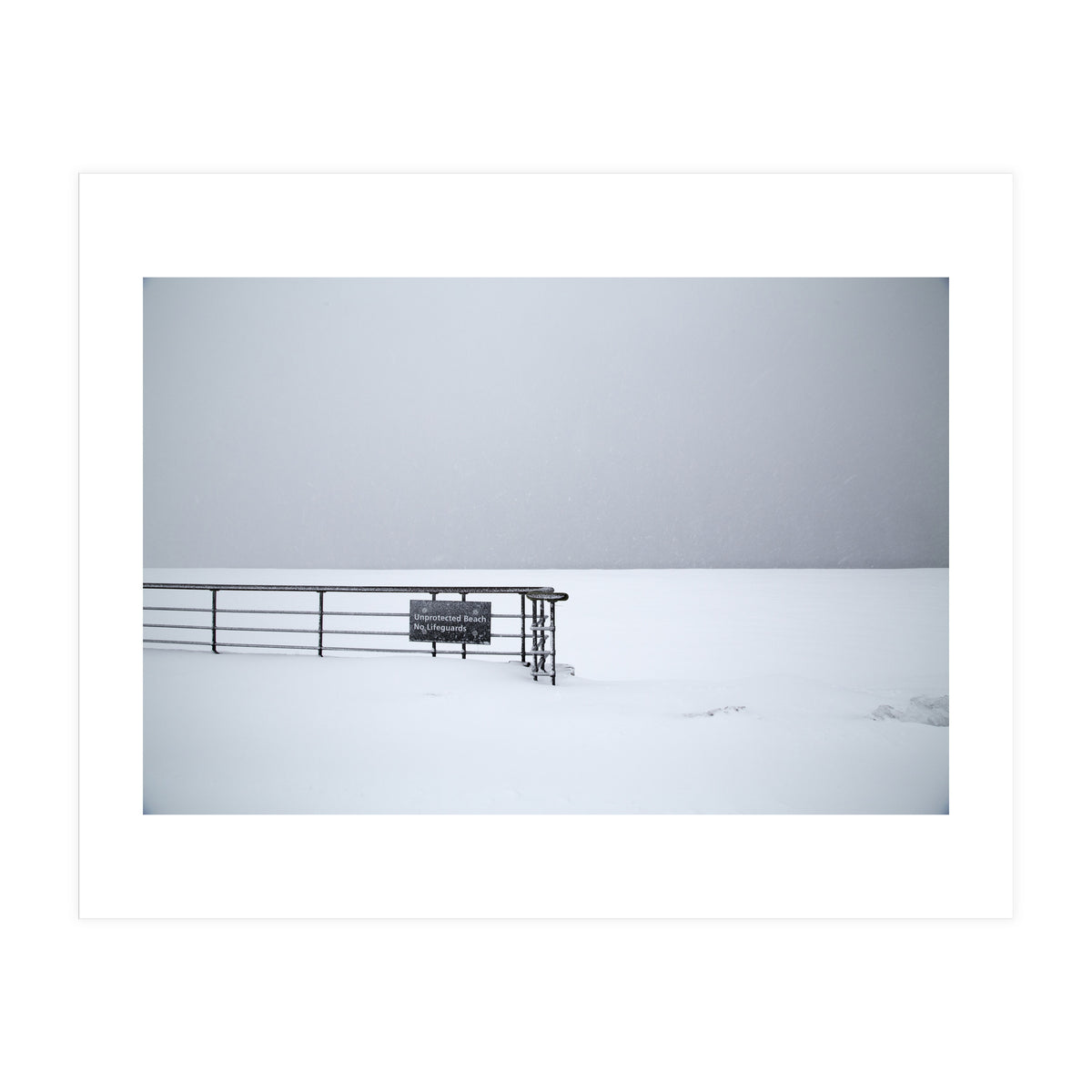 No lifeguards on the sign board in the winter snow beach (Print Only)
