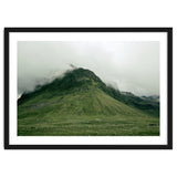 Green mountain covered in clouds - Iceland thumbnail