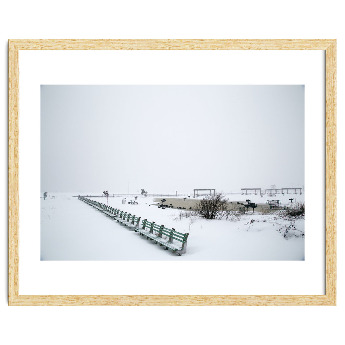 No people on a bench in the snowy winter