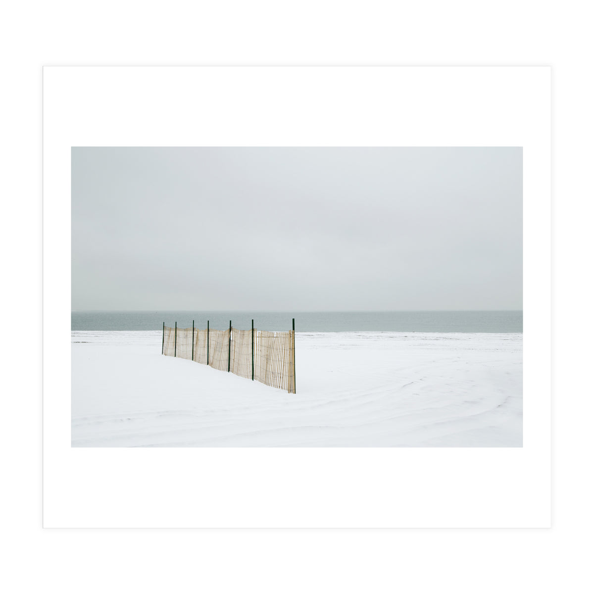 Wood fence in the winter snow beach (Print Only)