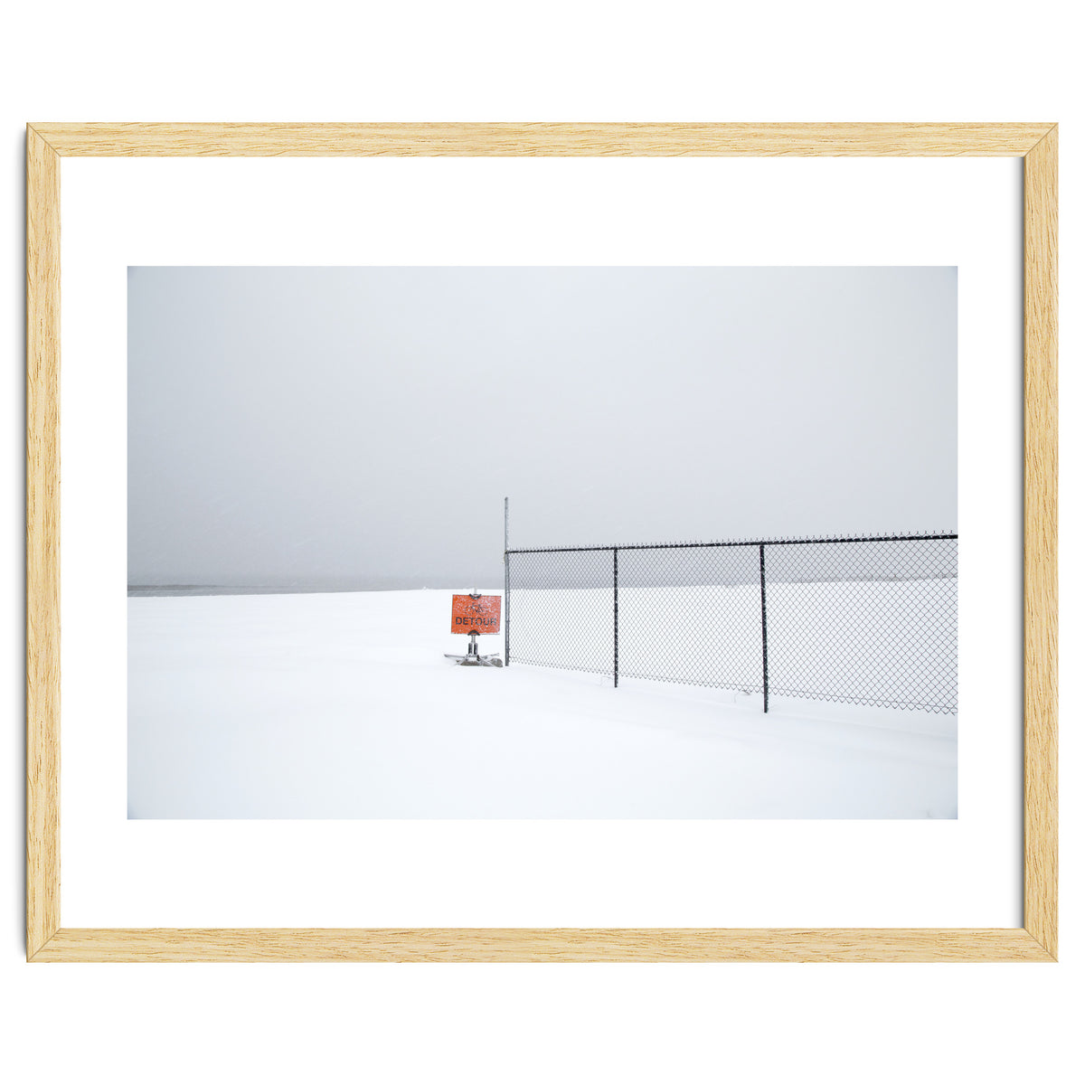 Detour sign in the snow beach