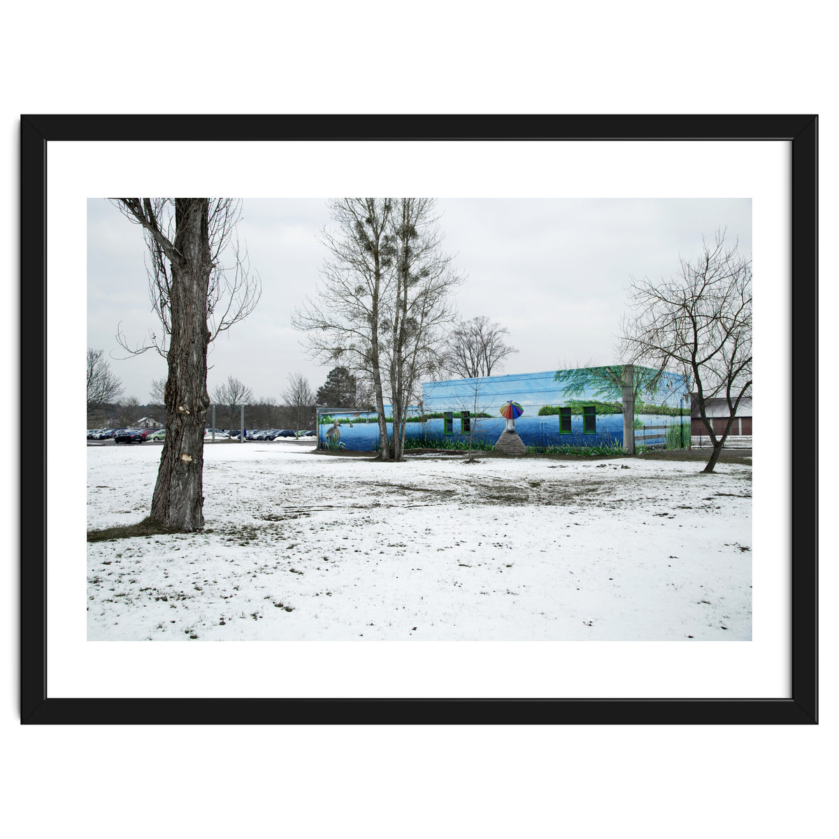 Colorful barn in the snowy ground landscape