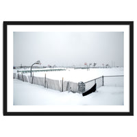 Snow-covered deserted basketball court in winter