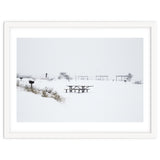 Tables and benches in a snow-covered park thumbnail