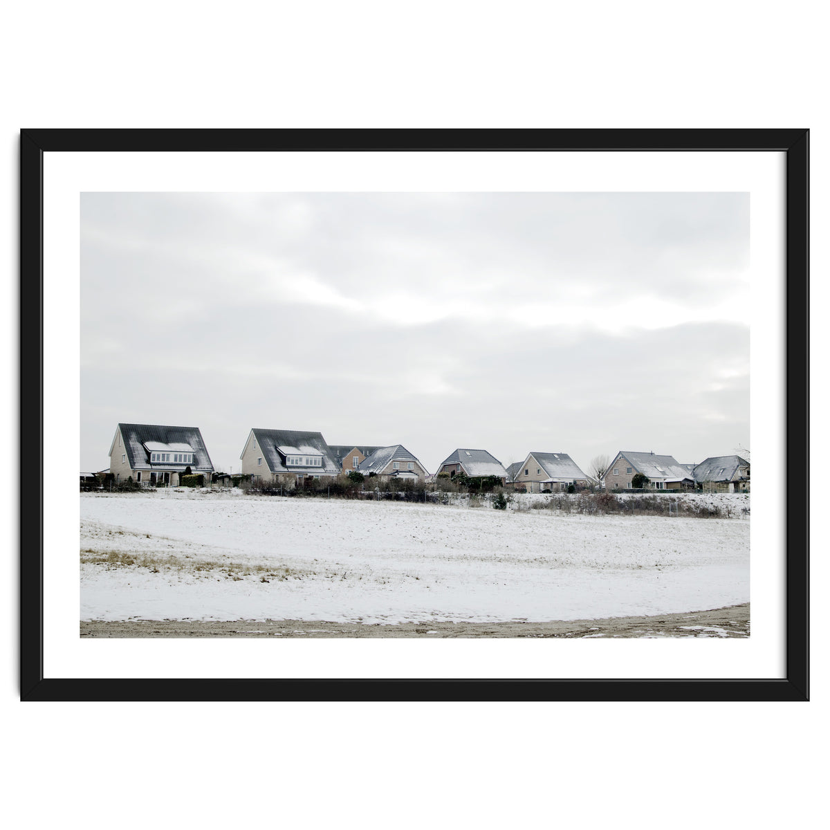 Snow covered houses on the hill