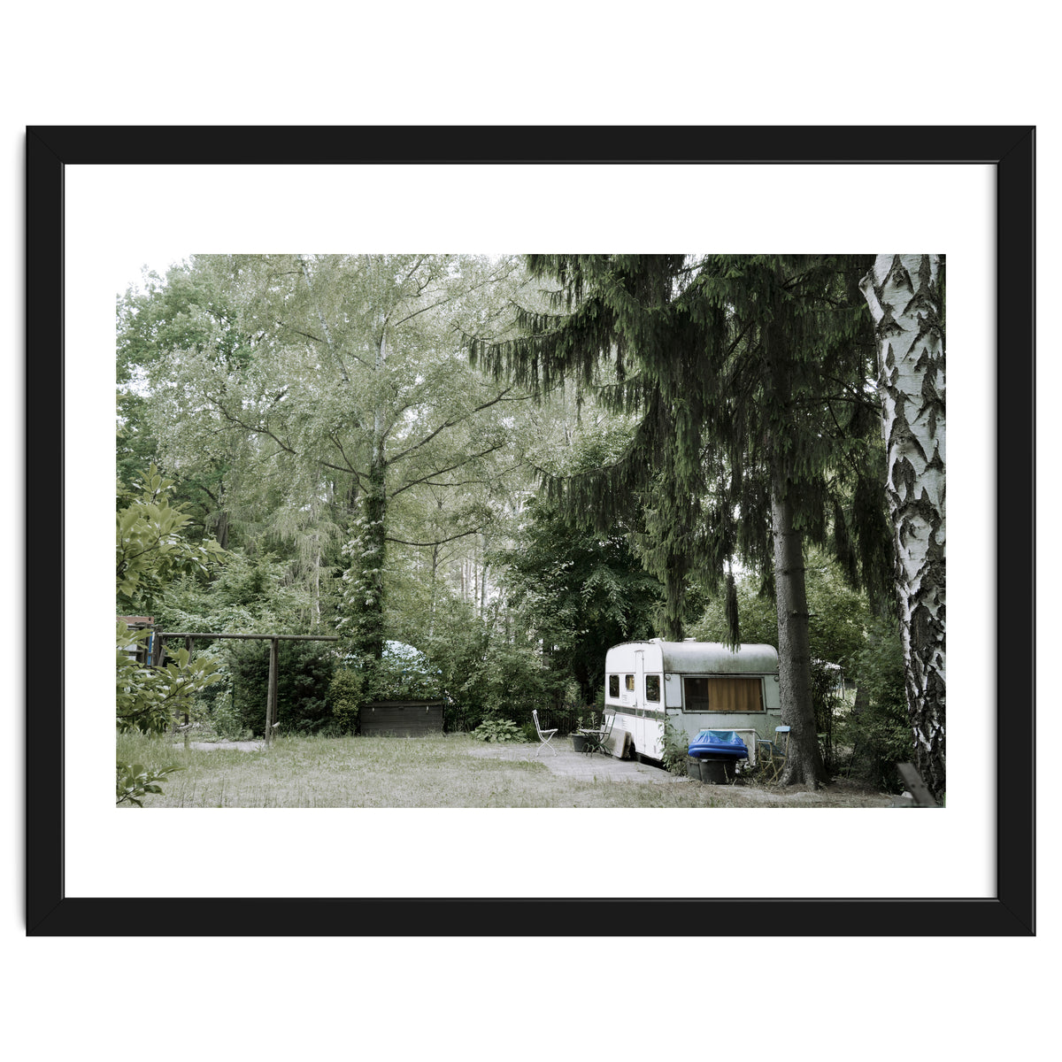 Travel trailer in the green garden