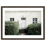White door K between the green botanical gate thumbnail