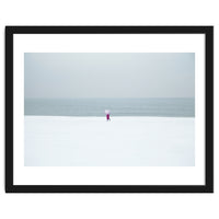 A walking woman in the winter snow beach