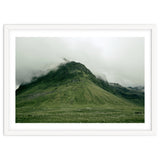 Green mountain covered in clouds - Iceland thumbnail