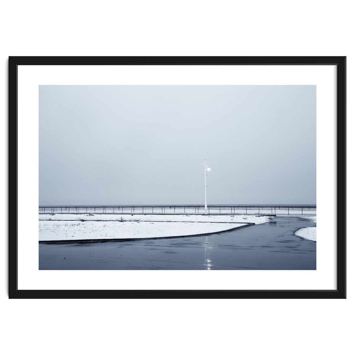 Street light turned on the winter snow street