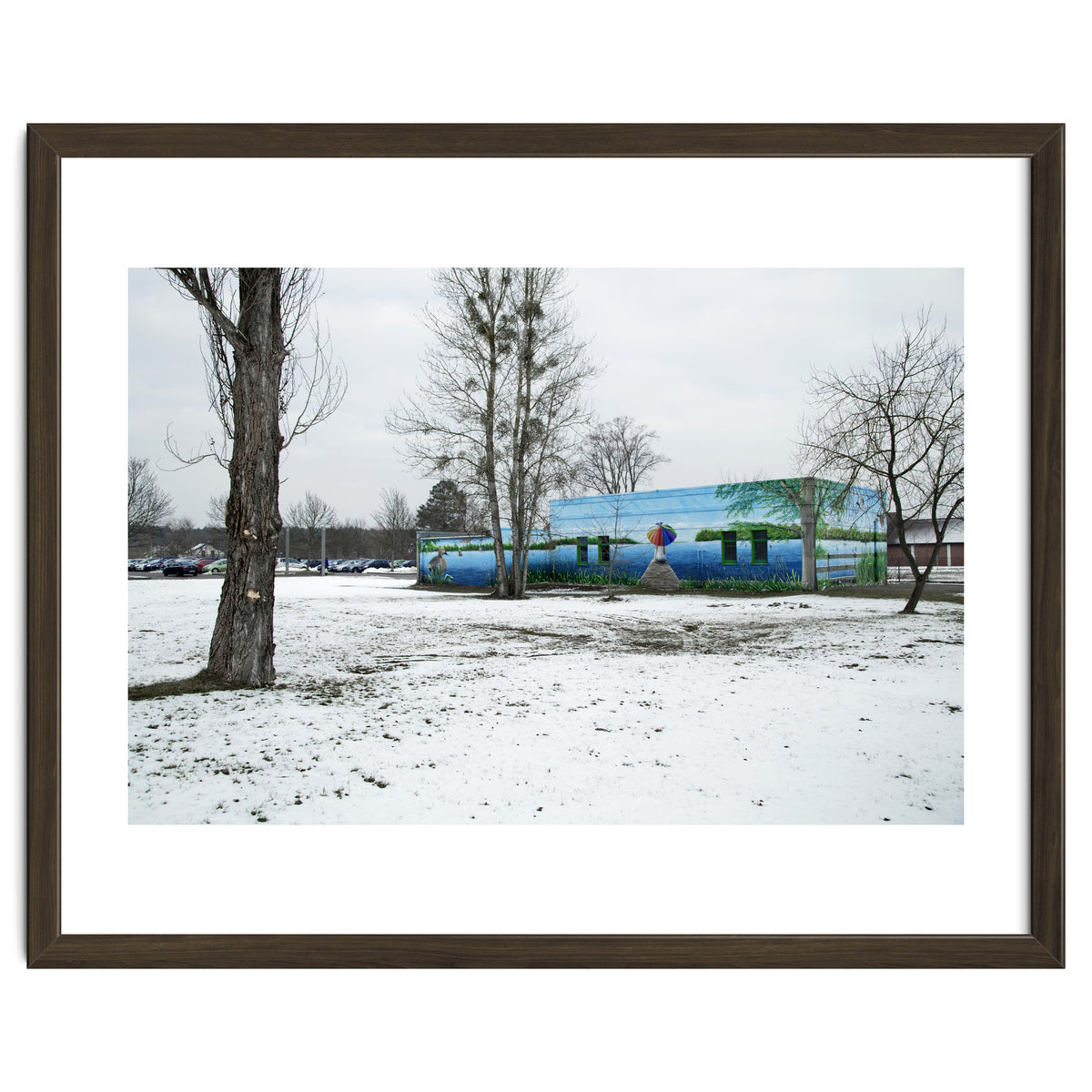 Colorful barn in the snowy ground landscape