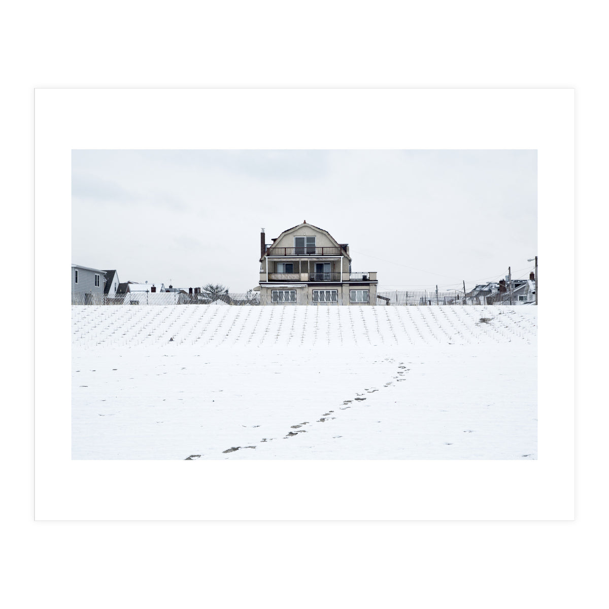 Footprints and house in winter snowscape (Print Only)
