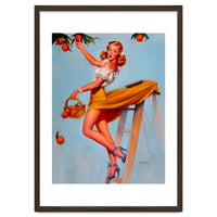 Pinup Sexy Woman Picking Oranges On A Tree Branch