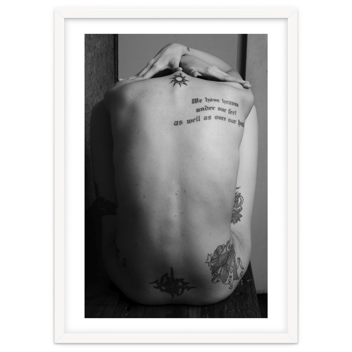 Naked body with saying as tattoo