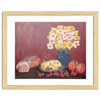 Still life with cheese, daffodils on a red background.