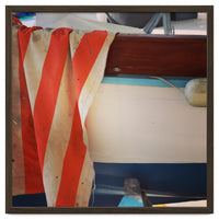 Fishing boat and striped sail