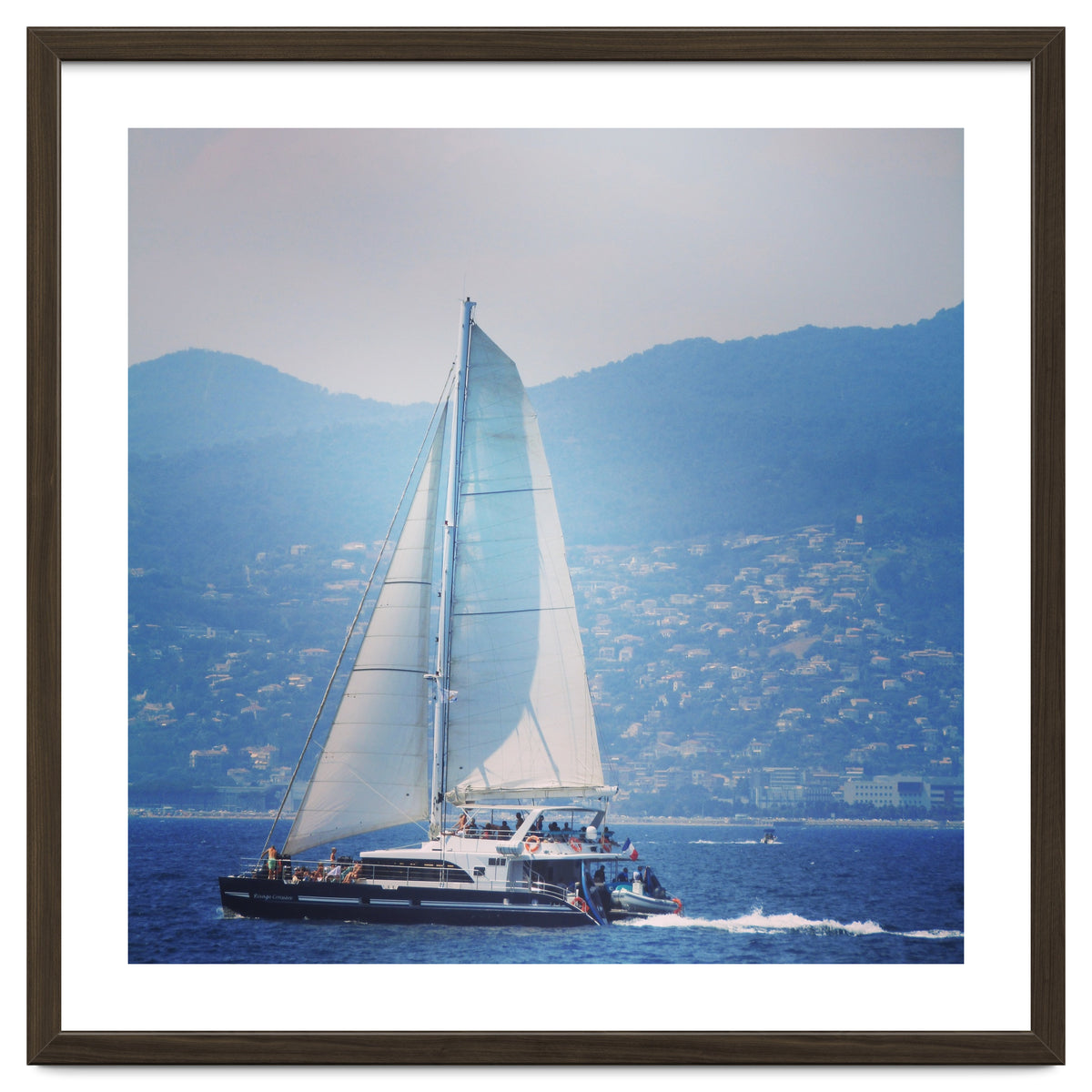 Modern yacht with white sails