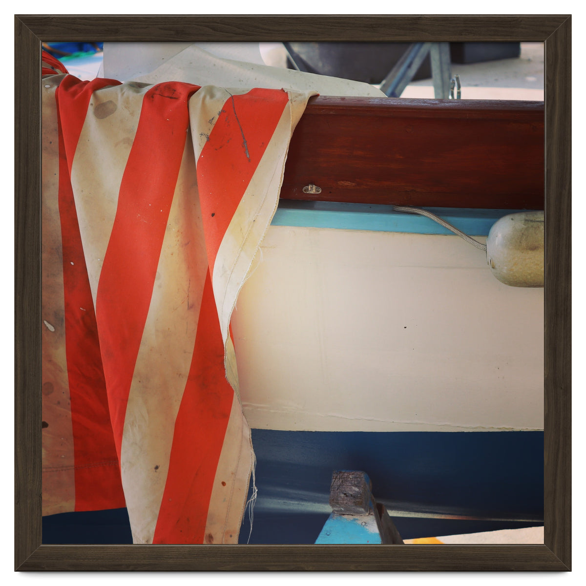 Fishing boat and striped sail