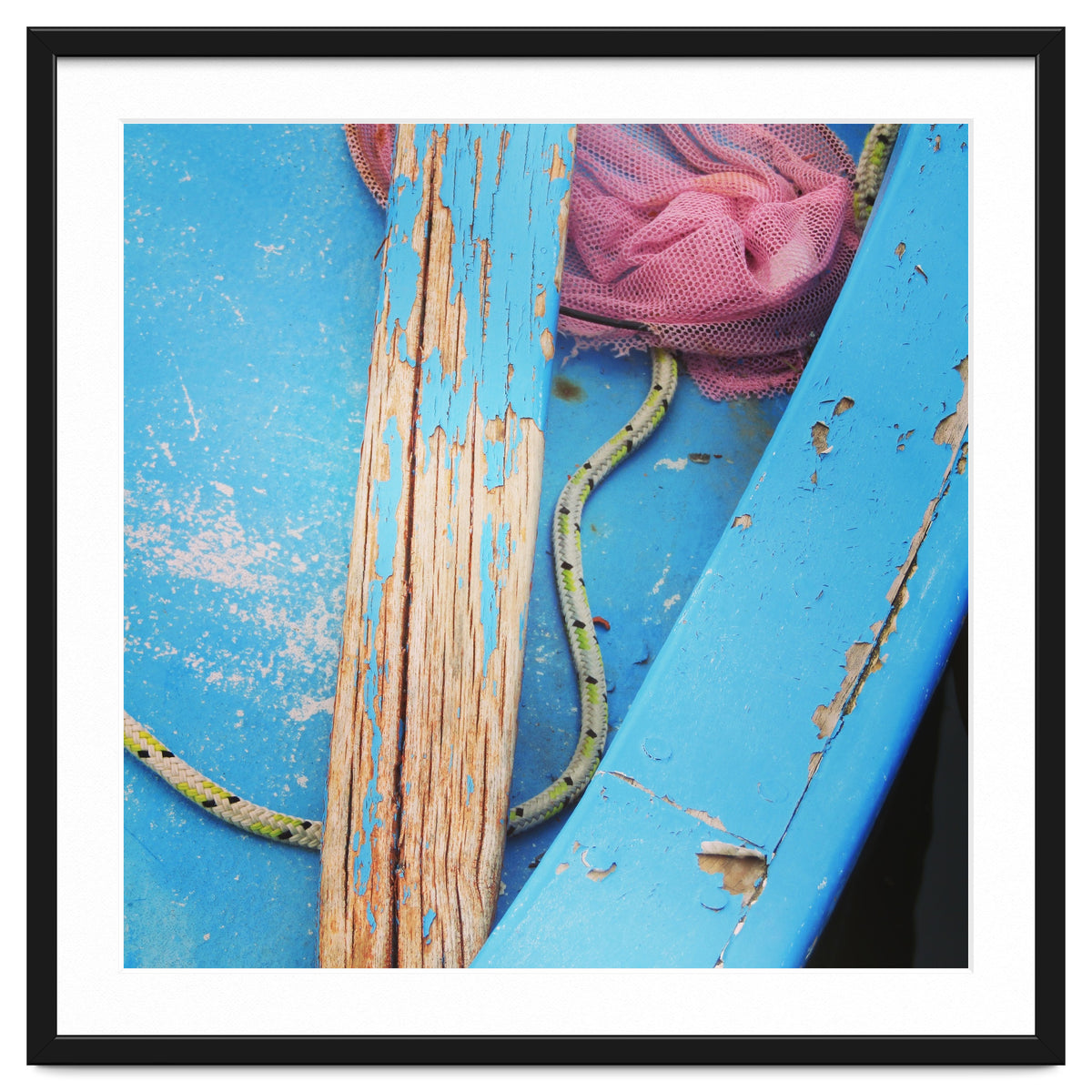 Weathered boat, sail and oar