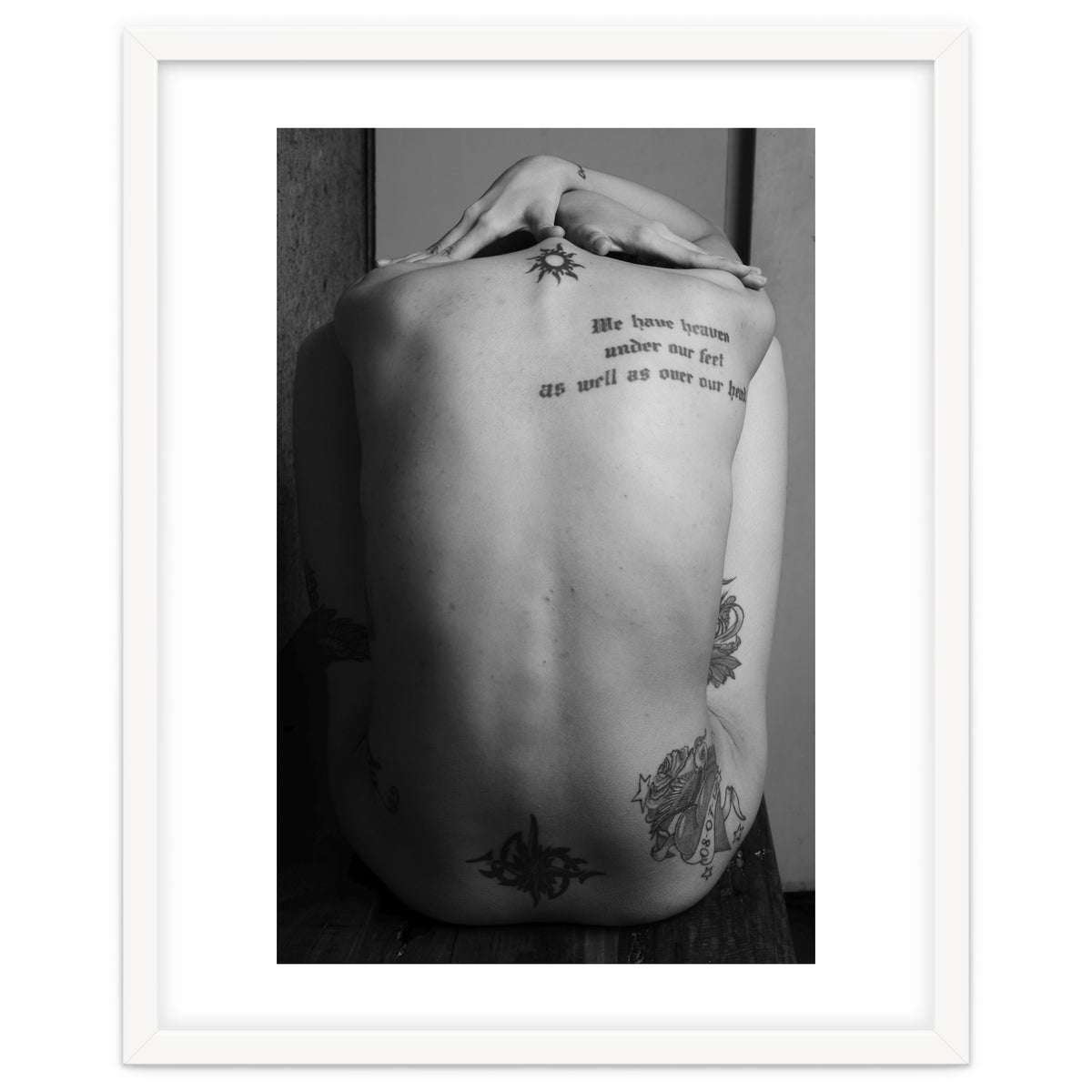 Naked body with saying as tattoo