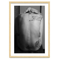 Naked body with saying as tattoo