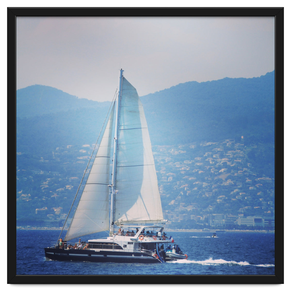 Modern yacht with white sails