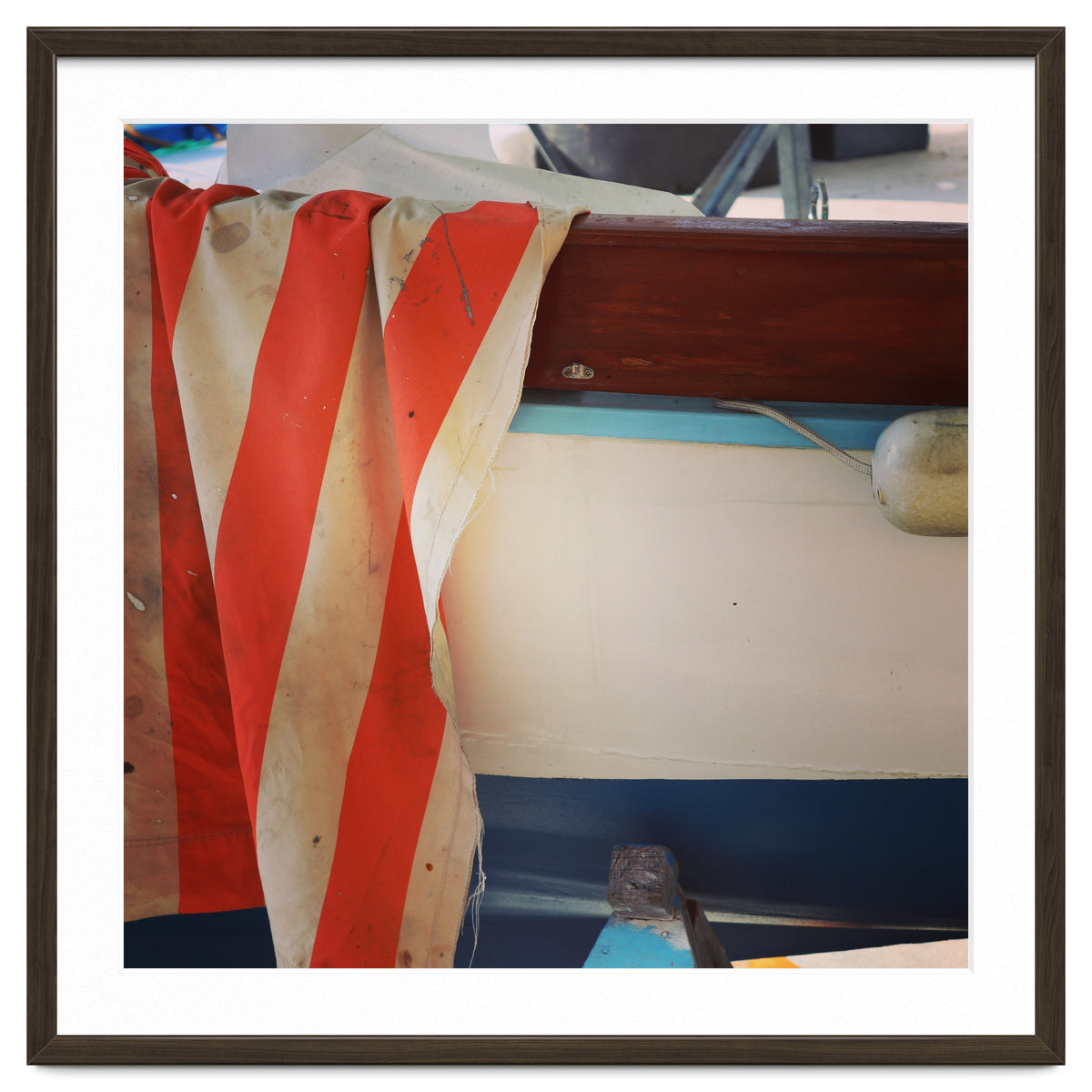 Fishing boat and striped sail