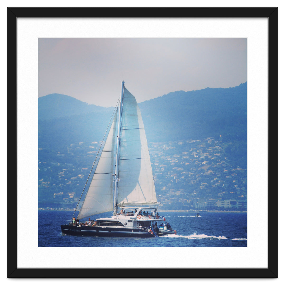 Modern yacht with white sails