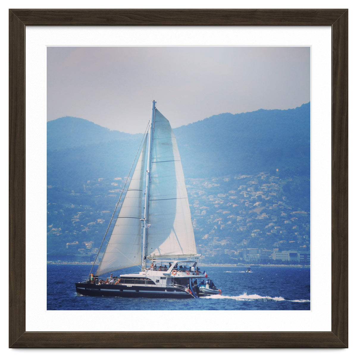 Modern yacht with white sails