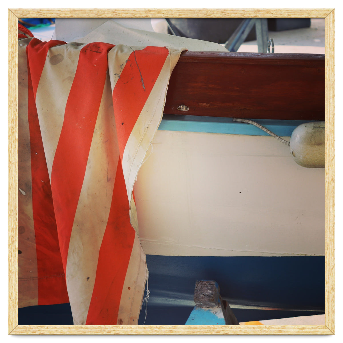 Fishing boat and striped sail