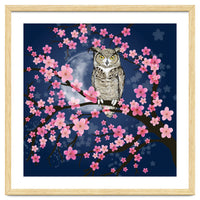 Great horned owl in a blossom tree