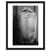 Naked body with saying as tattoo