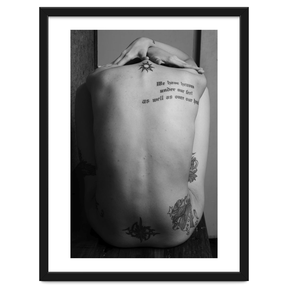 Naked body with saying as tattoo