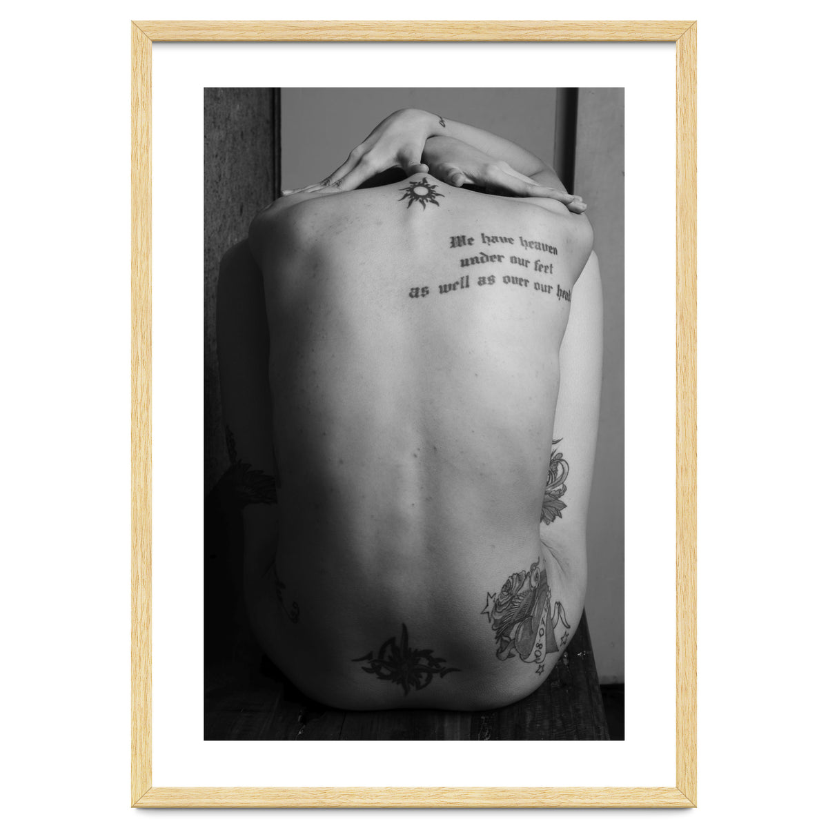 Naked body with saying as tattoo