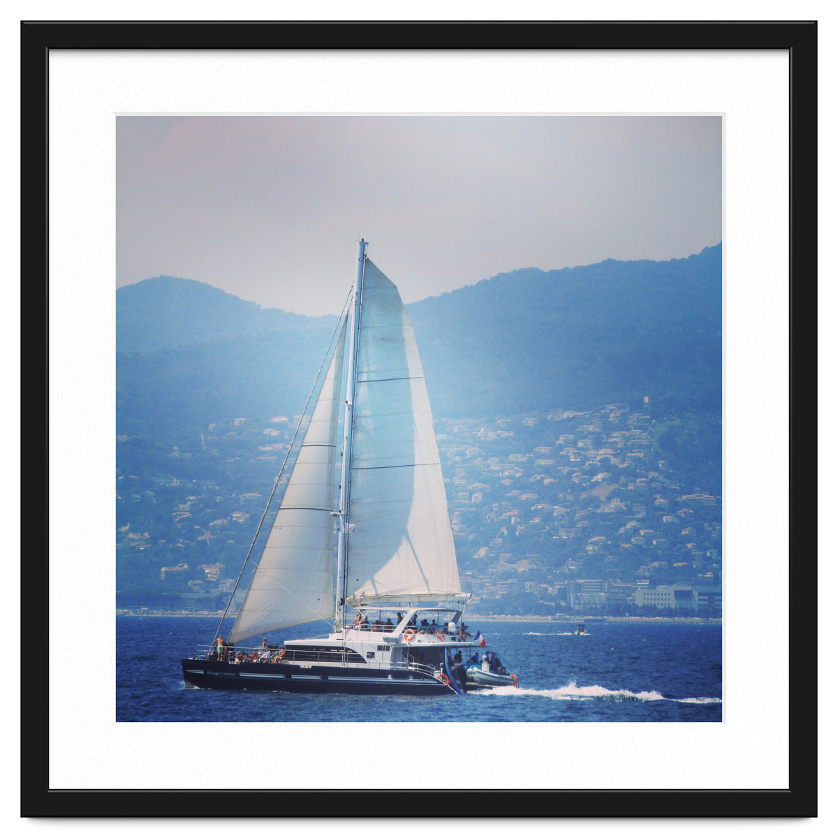 Modern yacht with white sails