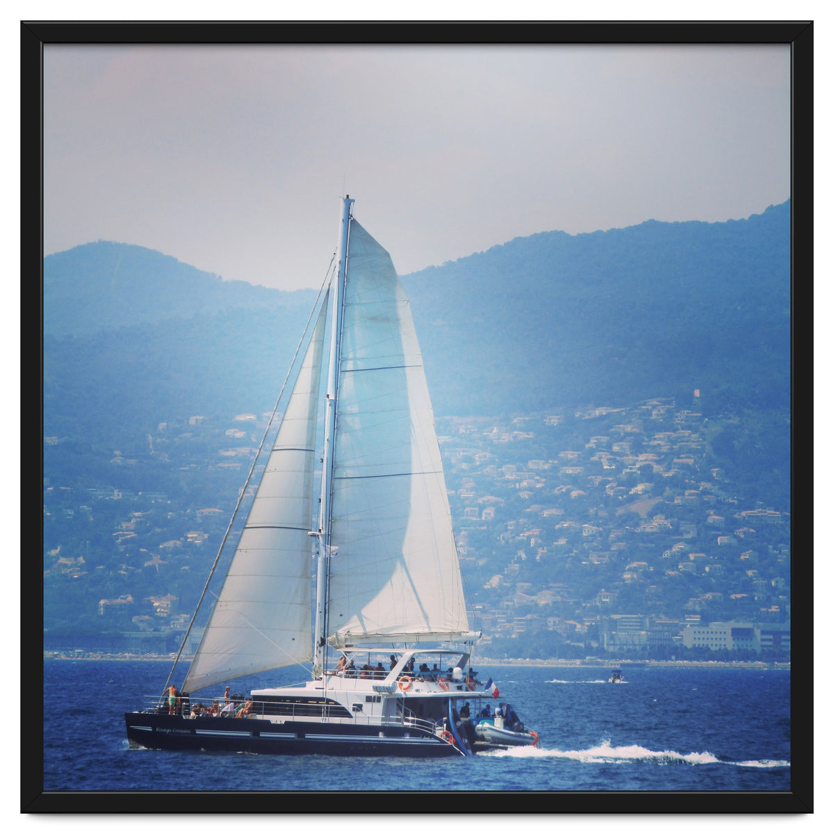 Modern yacht with white sails