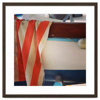 Fishing boat and striped sail
