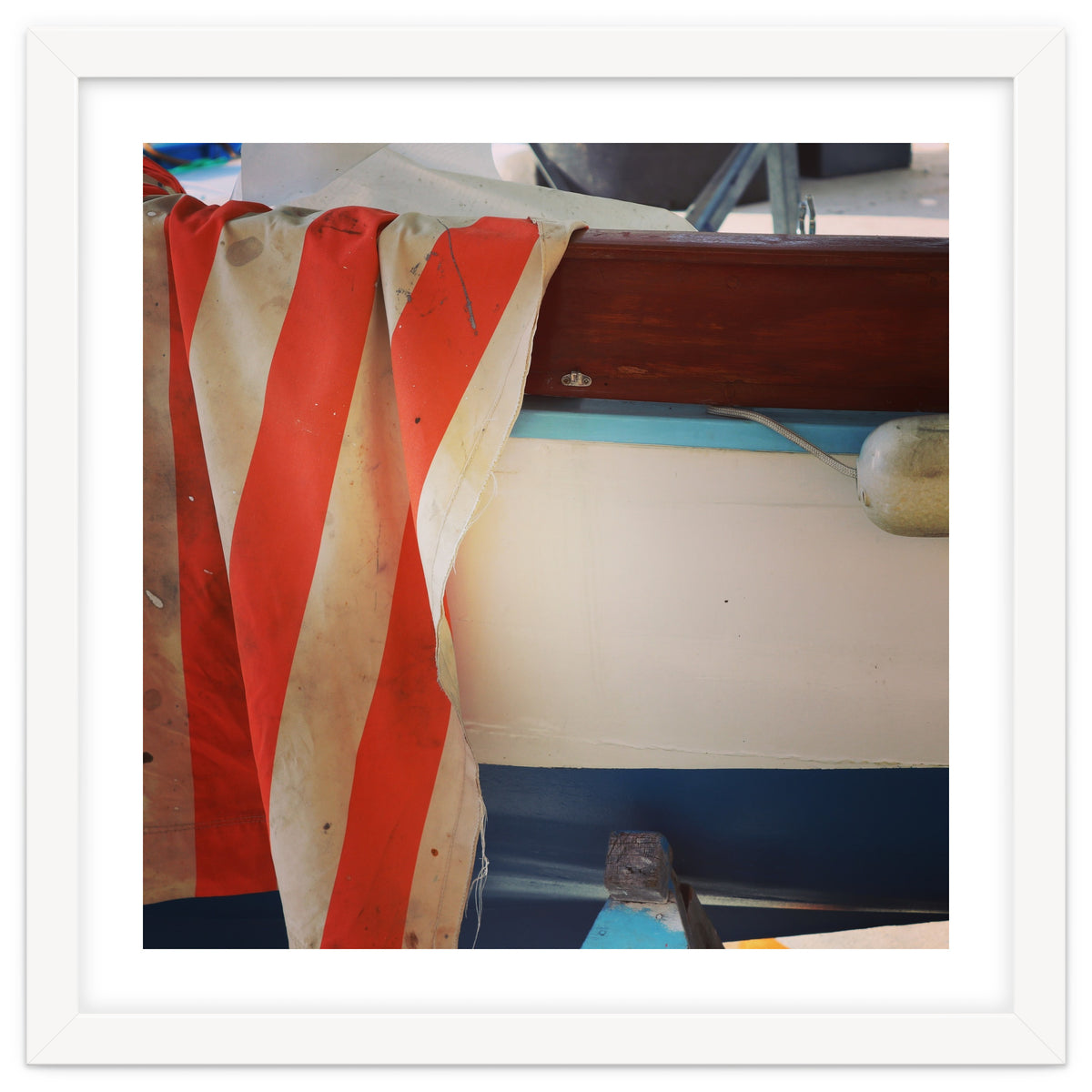 Fishing boat and striped sail