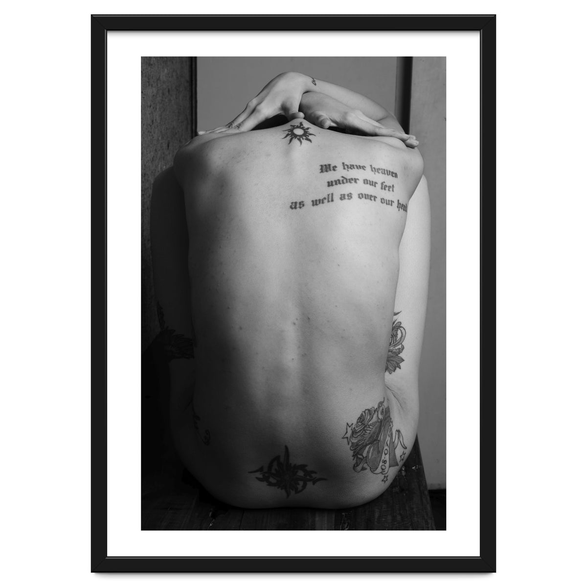Naked body with saying as tattoo