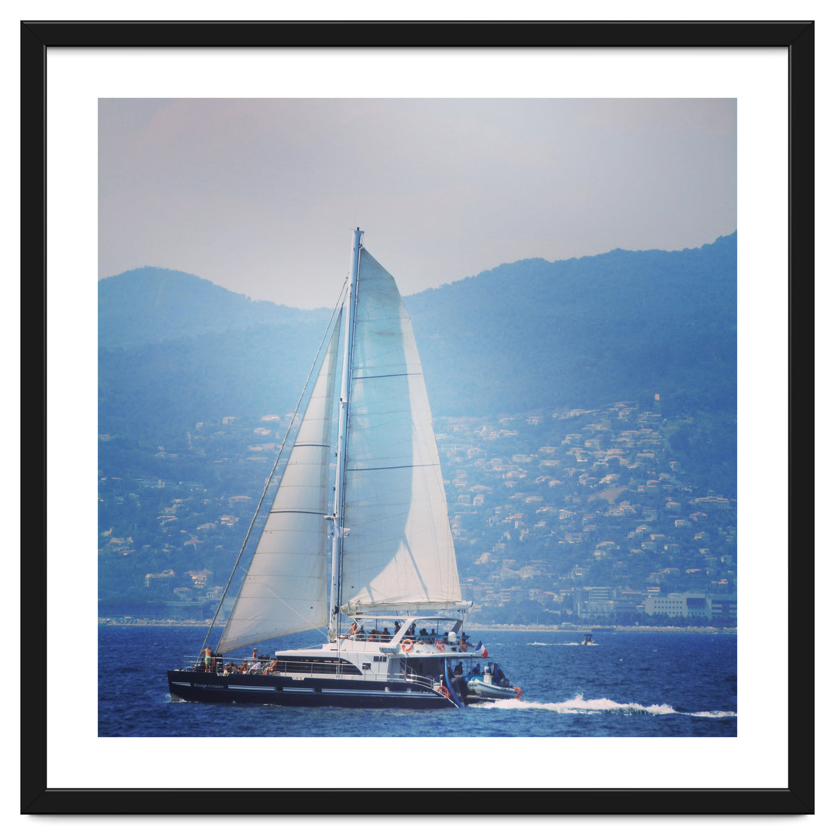 Modern yacht with white sails